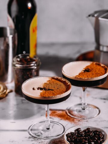 Two chai espresso martinis on a table.