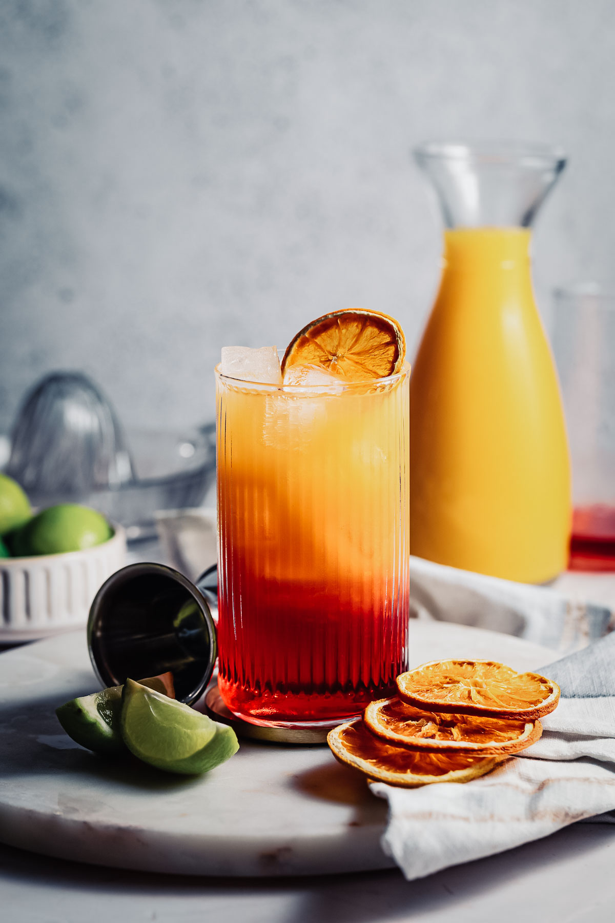 Side shot of a layered Madras cocktail in a highball glass. 