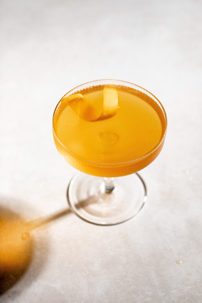 Overhead shot of the sidecar showing the color and lemon twist floating on top. 