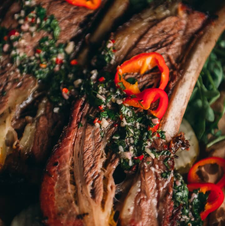 Beef ribs with chimichurri sauce. 