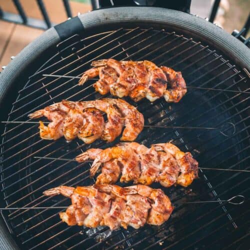 Shrimp with bacon on a grill. 