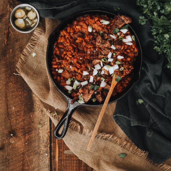 Skillet filled with abked beans. 