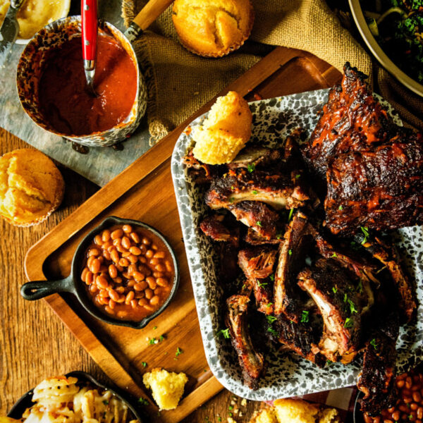 Platter of ribs, baked beans and corn bread. 