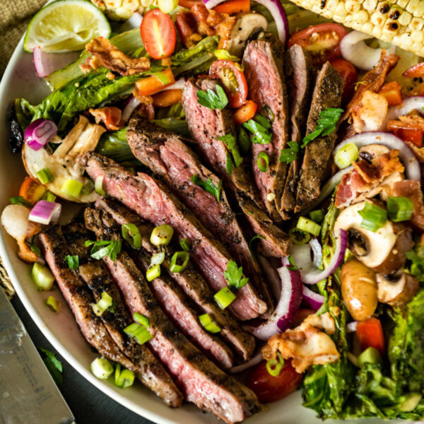 Overhead shot of sliced steak salad. 